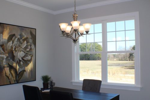 winslow homes custom kitchen table, a chandelier, and a wall painting