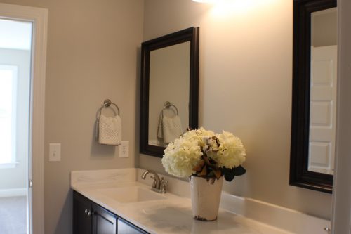 winslow homes custom bathroom with flowers on the counter